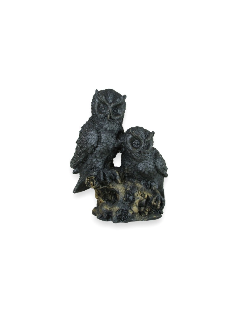 Búhos en tronco de piedra volcánica